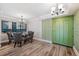 Bright dining area with a green accent wall and chandelier at 2413 Bayshore Blvd # 1004, Tampa, FL 33629