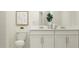 Double vanity bathroom with modern fixtures and storage at 2637 Sunray Venus Way, Ruskin, FL 33570