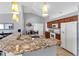 Well-lit kitchen with granite countertops, stainless steel appliances, and pendant lighting at 2653 Cover Ln, North Port, FL 34286