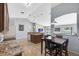 Modern kitchen featuring granite countertops, a central island, and an adjacent dining area at 2653 Cover Ln, North Port, FL 34286