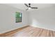 Spacious bedroom with a large window and hardwood floors at 2717 Briarpatch Dr, Valrico, FL 33596