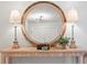 Entryway features a round mirror, console table, and lamps at 2717 Briarpatch Dr, Valrico, FL 33596