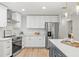 Stylish kitchen with white cabinets and quartz countertops at 2717 Briarpatch Dr, Valrico, FL 33596