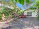 Private backyard with hot tub, lush landscaping, wooden deck and outdoor seating area at 2907 W Euclid Ave, Tampa, FL 33629