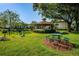 Outdoor seating area with gazebo, picnic table, and barbecue grill with a pond view at 3377 Crystal E Ct # E, Palm Harbor, FL 34685