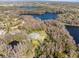 Aerial view of the house and surrounding lakefront property at 3663 Berger Rd, Lutz, FL 33548