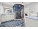 Bright bathroom featuring a modern vanity, square sink, framed mirror, and luxurious tiled walk-in shower at 3663 Berger Rd, Lutz, FL 33548