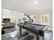 Large game room with a pool table, high ceilings, large windows and marbled floors at 3663 Berger Rd, Lutz, FL 33548