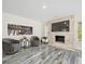 Comfortable sitting area featuring a fish tank, modern chairs, and elegant marbled floors at 3663 Berger Rd, Lutz, FL 33548