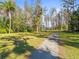 Expansive yard with mature trees that adds character and shade to the property at 3663 Berger Rd, Lutz, FL 33548