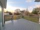 Gray deck overlooks a spacious backyard with sunset view at 3749 Loury Dr, Wesley Chapel, FL 33543