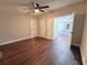 Spacious bedroom with ceiling fan and dark brown laminate flooring at 3749 Loury Dr, Wesley Chapel, FL 33543