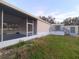 Mobile home with screened porch and gray deck at 3749 Loury Dr, Wesley Chapel, FL 33543