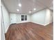 Bright living room features hardwood floors and recessed lighting at 3749 Loury Dr, Wesley Chapel, FL 33543