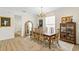 Formal dining room with hardwood floors, a large table, and decorative accents at 3814 W Sevilla St, Tampa, FL 33629