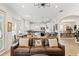 Open living area with a brown leather couch, looking towards kitchen and dining at 3814 W Sevilla St, Tampa, FL 33629