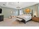 Spacious main bedroom with a king-size bed and calming decor at 3814 W Sevilla St, Tampa, FL 33629