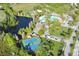 Aerial view of the community showing the pool, lake, tennis courts and clubhouse at 4110 Huntingdale Ct, Wesley Chapel, FL 33543