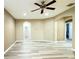 Large bonus room with wood-look floors and neutral walls at 4110 Huntingdale Ct, Wesley Chapel, FL 33543