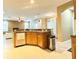 Kitchen island with granite countertops and stainless steel appliances at 4110 Huntingdale Ct, Wesley Chapel, FL 33543