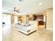 Spacious living room with tile floors and a view of the kitchen at 4110 Huntingdale Ct, Wesley Chapel, FL 33543