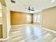 Bright living room featuring hardwood floors and a ceiling fan at 4110 Huntingdale Ct, Wesley Chapel, FL 33543