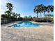 Resort-style pool with lounge chairs and palm trees for a relaxing experience at 4110 Huntingdale Ct, Wesley Chapel, FL 33543