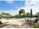 Resort-style pool with plenty of lounge chairs and umbrellas at 4110 Huntingdale Ct, Wesley Chapel, FL 33543