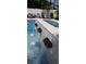 Close-up of the pool's water features, showing copper spillways and tranquil waterfalls at 430 173Rd E Ave, North Redington Beach, FL 33708