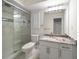 Bathroom with granite countertop, single sink, and glass shower at 476 Harbor S Dr, Indian Rocks Beach, FL 33785