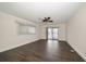 Spacious bedroom with dark wood flooring and sliding glass doors at 476 Harbor S Dr, Indian Rocks Beach, FL 33785