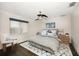 Guest bedroom with dark wood floors, ceiling fan, and calming decor at 476 Harbor S Dr, Indian Rocks Beach, FL 33785