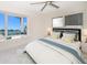 Bright bedroom with bay window, water views, and comfortable bedding at 476 Harbor S Dr, Indian Rocks Beach, FL 33785