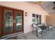 Exterior view showing entrance with double stained glass doors and seating area at 476 Harbor S Dr, Indian Rocks Beach, FL 33785