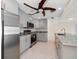 Modern kitchen with gray cabinets and granite countertops at 476 Harbor S Dr, Indian Rocks Beach, FL 33785