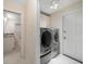 Laundry room with washer, dryer, and access to the exterior at 476 Harbor S Dr, Indian Rocks Beach, FL 33785