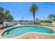 Inviting kidney-shaped pool with patio and water views at 476 Harbor S Dr, Indian Rocks Beach, FL 33785