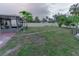 Large backyard with a grassy area at 5108 Redwood Ter, North Port, FL 34286