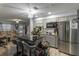 Kitchen with gray cabinets, granite island, and stainless steel appliances at 5108 Redwood Ter, North Port, FL 34286