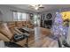 Living room featuring hardwood floors, sectional sofa, and a TV at 5108 Redwood Ter, North Port, FL 34286