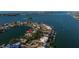 Panoramic aerial view of a waterfront neighborhood with scenic bridge and distant cityscape at 521 Harbor N Dr, Indian Rocks Beach, FL 33785