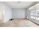 Spacious room with blue walls offers lots of natural light; ready for renovation at 521 Harbor N Dr, Indian Rocks Beach, FL 33785