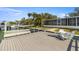 Waterfront dock with comfortable seating offers the perfect spot to enjoy waterfront living at 521 Harbor N Dr, Indian Rocks Beach, FL 33785