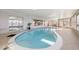 Indoor pool features a unique design and lots of windows for natural light at 521 Harbor N Dr, Indian Rocks Beach, FL 33785