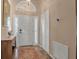 Bright entryway with a white door, tile floor, and a built-in storage closet at 5232 White Sand Ne Cir, St Petersburg, FL 33703