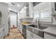 Modern kitchen with stainless steel appliances and farmhouse sink at 5232 White Sand Ne Cir, St Petersburg, FL 33703