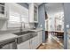 Bright kitchen with white shaker cabinets and a large farmhouse sink at 5232 White Sand Ne Cir, St Petersburg, FL 33703