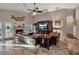 Bright living room featuring a fireplace, large TV, and comfortable leather seating at 5232 White Sand Ne Cir, St Petersburg, FL 33703