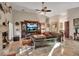 Sunlit living room showcasing a fireplace, large sectional sofa, and high ceilings at 5232 White Sand Ne Cir, St Petersburg, FL 33703