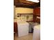 Basement laundry area with washer, dryer, and utility sink at 5353 Shaw St, New Port Richey, FL 34652